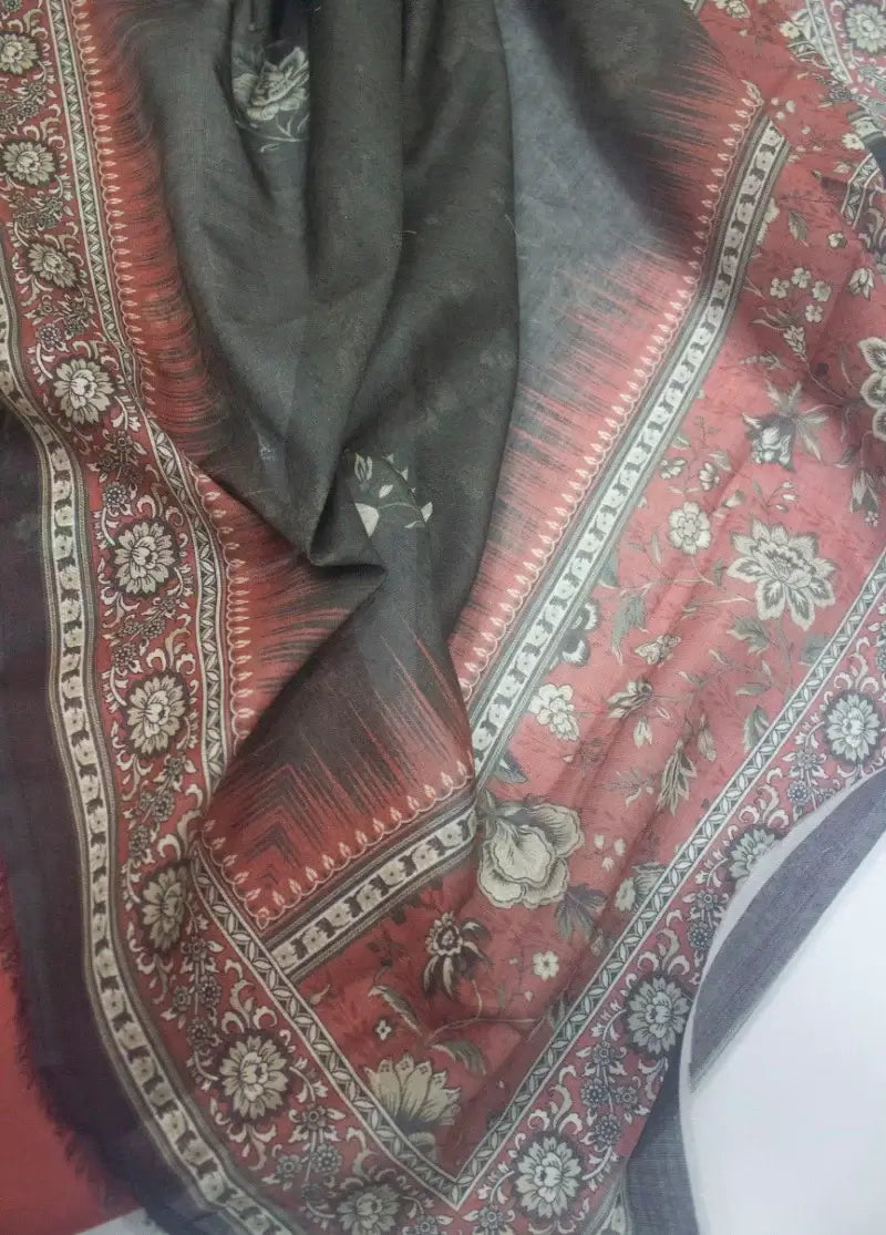 Decorative red and black patterned fabric with intricate designs
