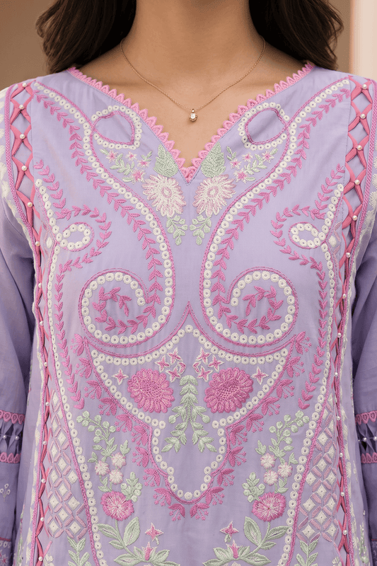 Close-up of a lavender embroidered garment with pink and green details.