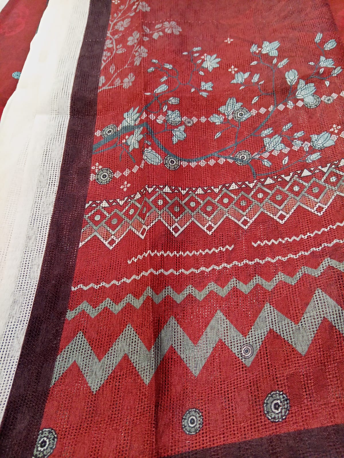 Close-up of the printed design on the shirt of the Maroon MTJ 3pc Unstitched Khaddar Suit