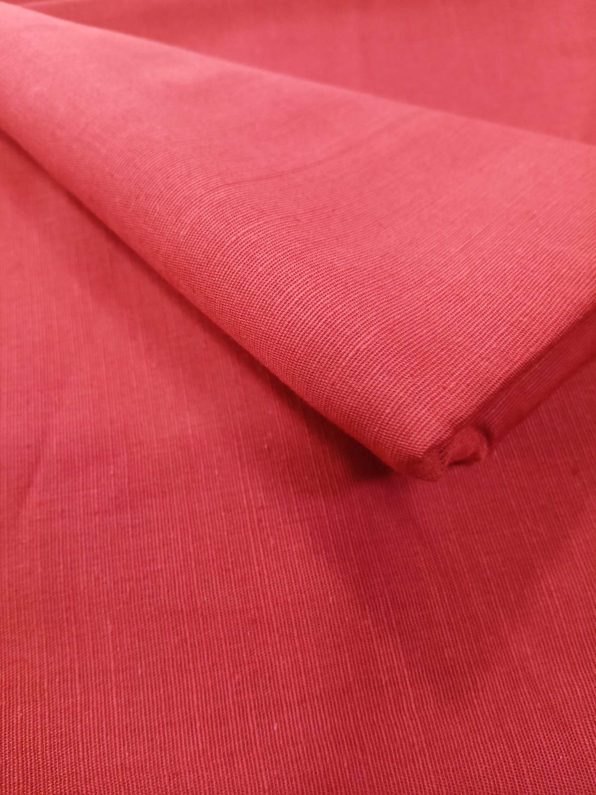 Close-up of the printed design on the shirt of the Maroon MTJ 3pc Unstitched Khaddar Suit