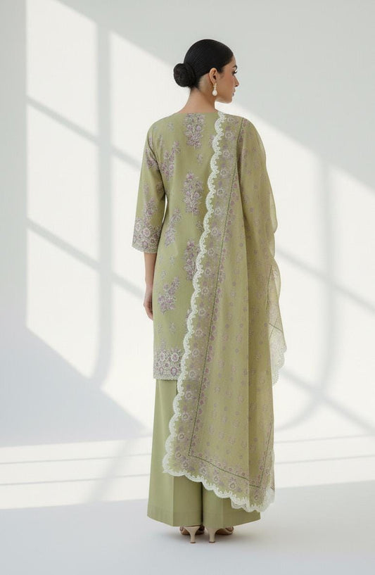 Cross Stitch 3 Piece - Printed Unstitched Lawn featuring a woman in olive green lawn outfit with dupatta.