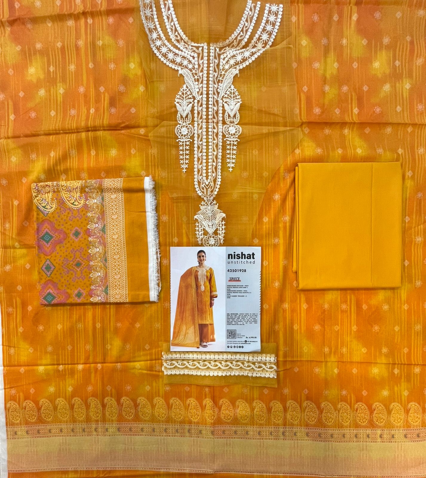Full layout display of the shirt, dupatta, and trousers of the Nisha By Nishat Embroidered Lawn 3pc.