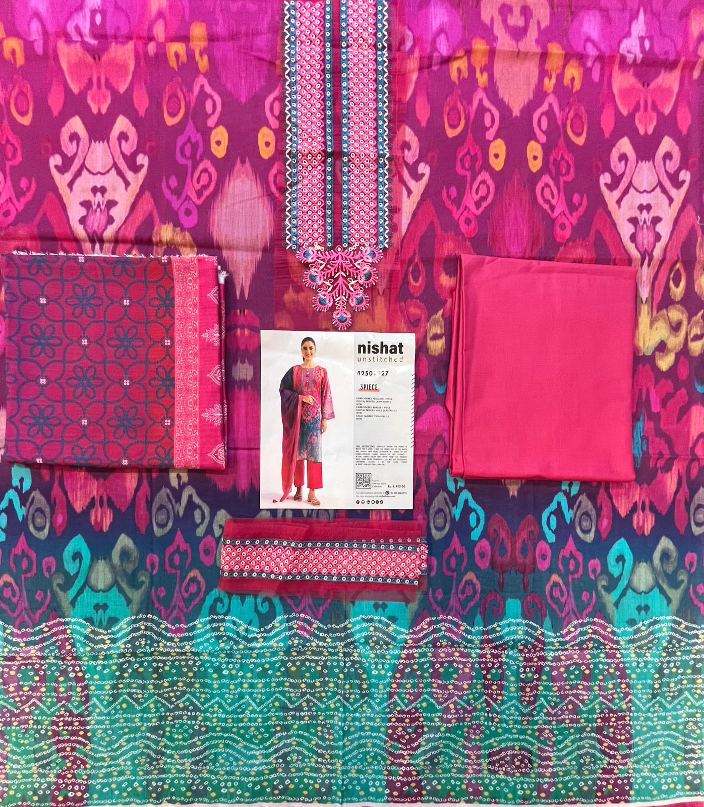 Full layout display of the shirt, dupatta, and trousers of the Nisha By Nishat Embroidered Lawn 3pc.