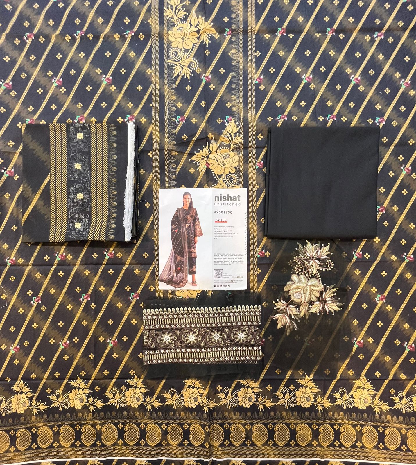 Full layout display of the shirt, dupatta, and trousers of the Nisha By Nishat Embroidered Lawn 3pc.