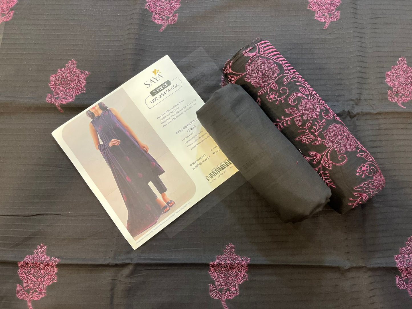 Close-up texture of Black Saya Cotton Jacquard 3pc self-woven fabric.