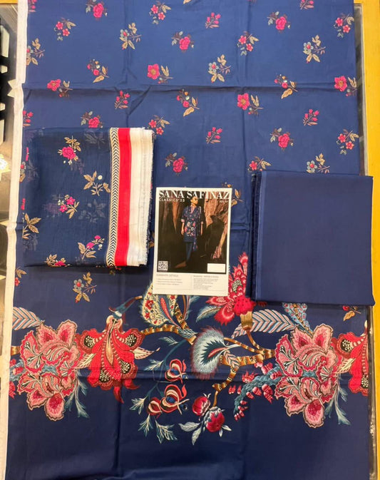 Blue fabric with floral patterns and embroidered designs on a yellow background