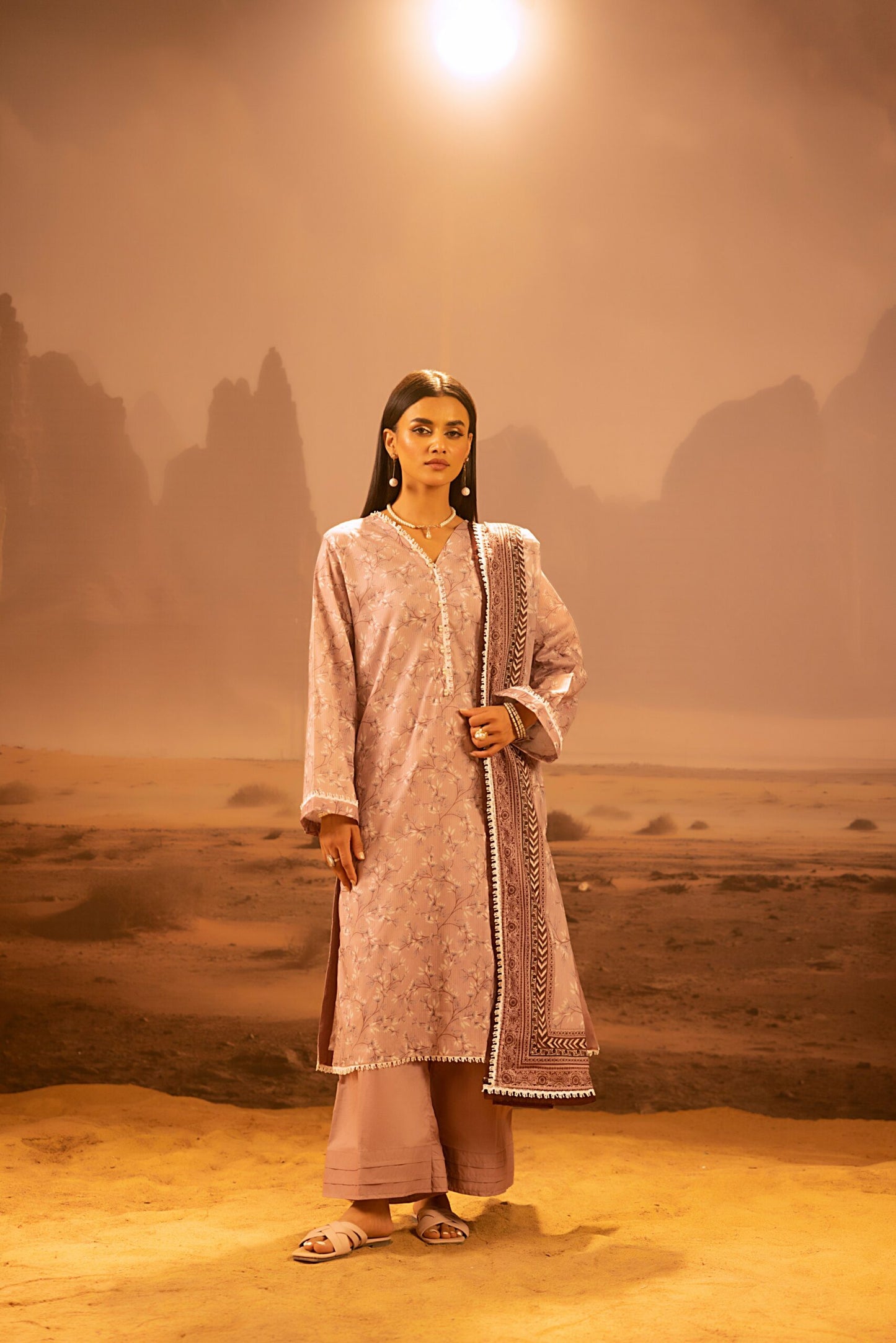 A model wearing the Salina 3pc Unstitched Mid Summer Cotton Dusty Pink suit
