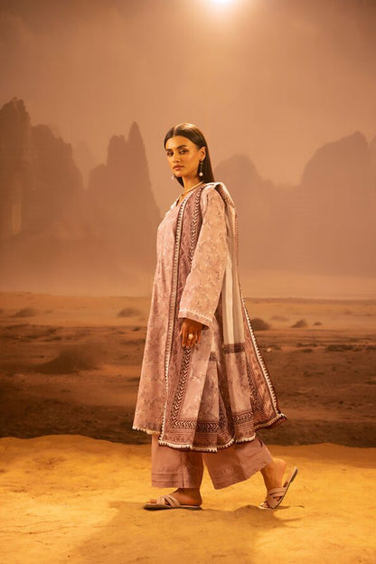 A model wearing the Salina 3pc Unstitched Mid Summer Cotton Dusty Pink suit