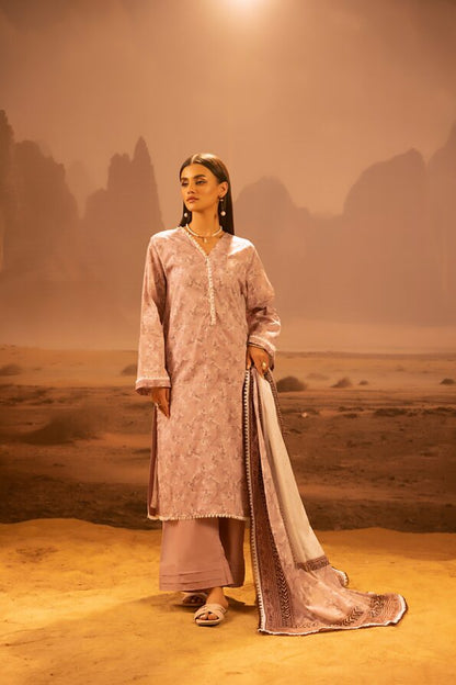 A model wearing the Salina 3pc Unstitched Mid Summer Cotton Dusty Pink suit