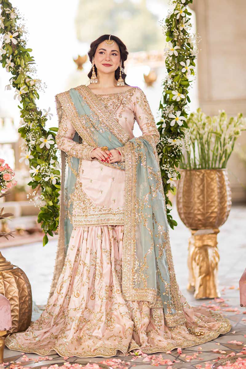 Hania Embroidered Net Gharara 3pc - Baby Pink (Replica) with intricate embellishments and a beautiful net dupatta.