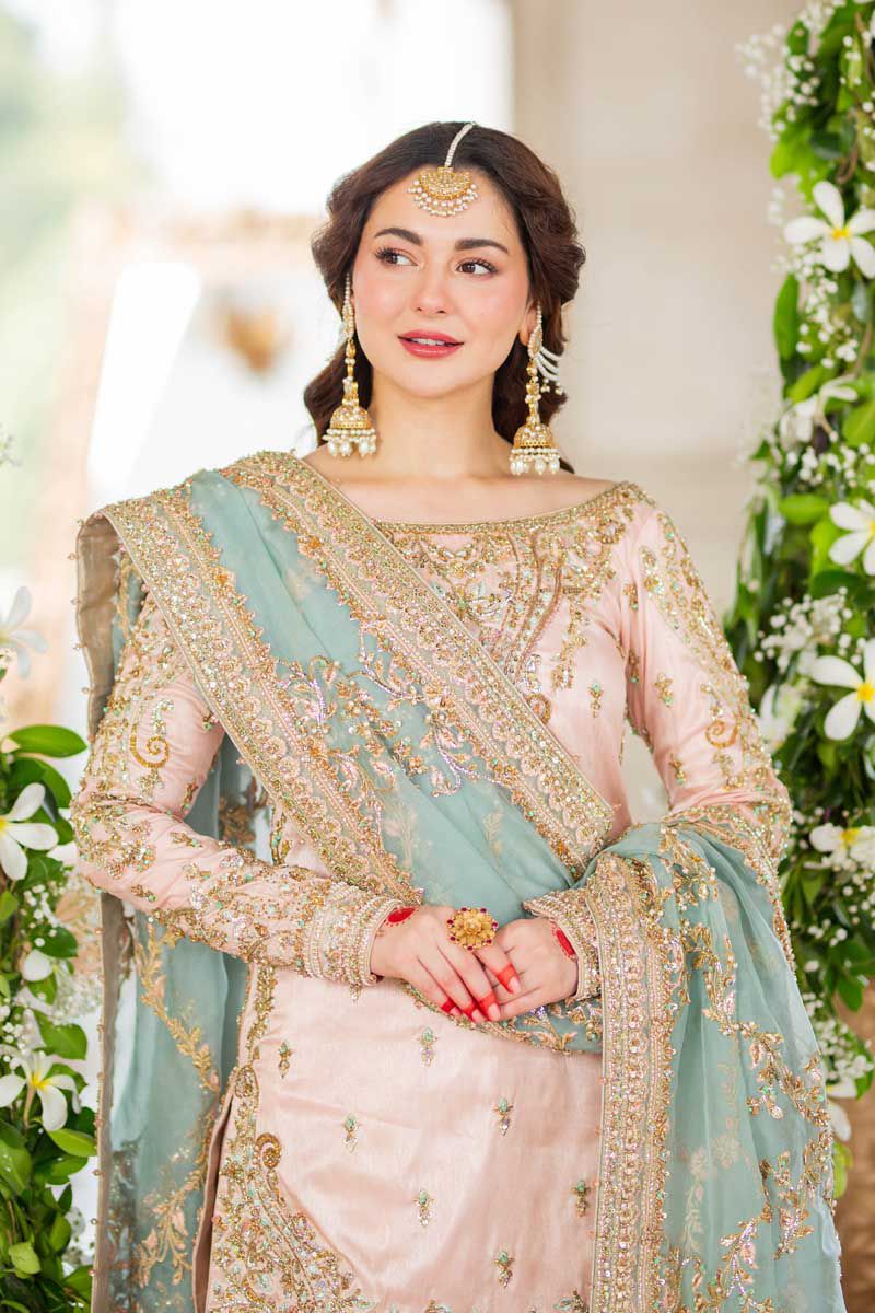 Hania Embroidered Net Gharara 3pc in baby pink with intricate embellishments and elegant design
