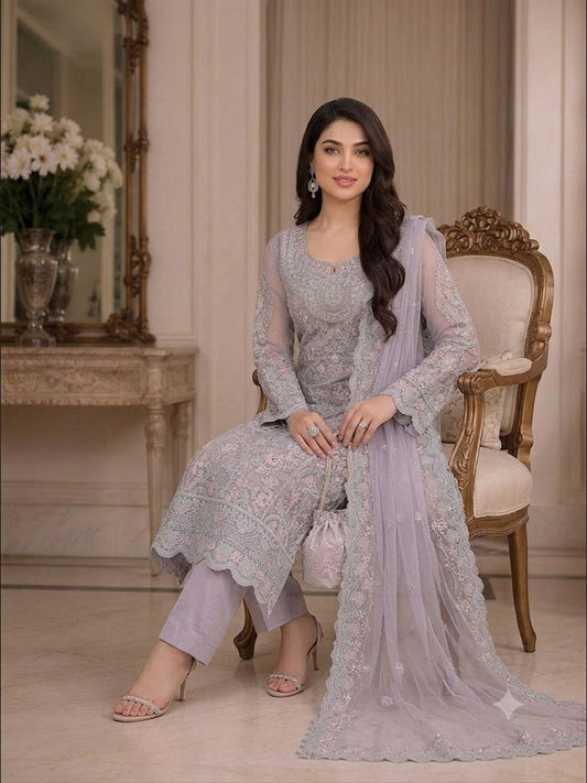 High-fashion display showcasing the unstitched layout and Shamooz silk trouser of the Organza Formal Embroidered Mauve suite.
