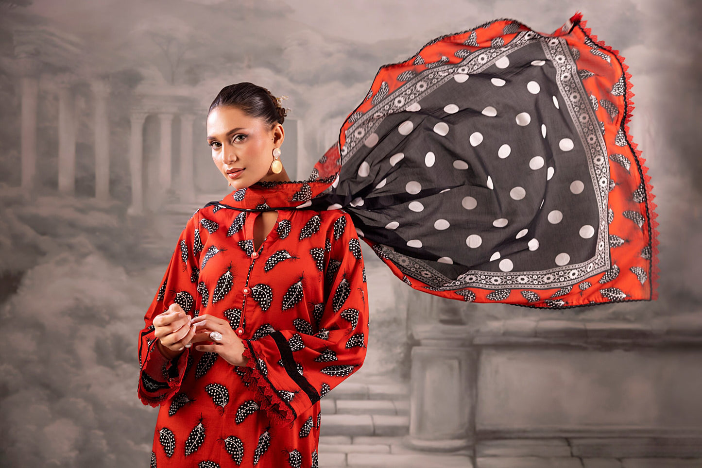 Red Salina Separates Lawn Collection suit worn by model for a bold, festive summer look.