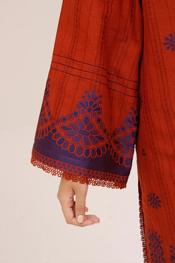 Rust Saya Cotton Jacquard 3pc suit worn by model showcasing luxury unstitched tailoring.