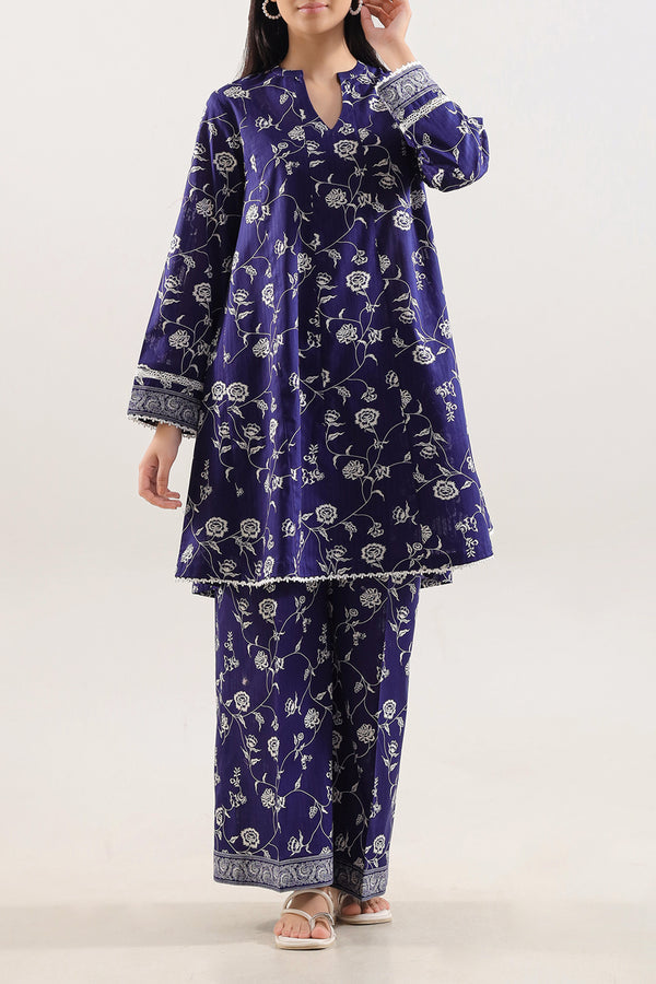 Model wearing Saya 2pc Unstitched Lawn Suit