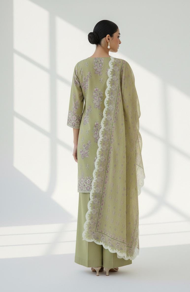Cross Stitch 3 Piece - Printed Unstitched Lawn featuring a woman in olive green lawn outfit with dupatta.