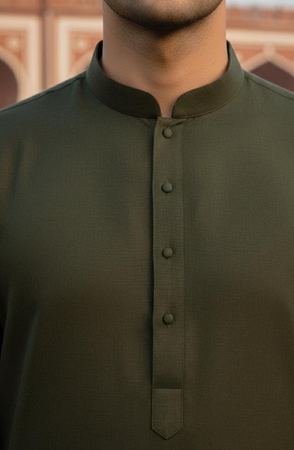 Dark Green Zellbury Mens Wash and Wear unstitched suit worn by a model showcasing a sharp tailored fit for Summer 2026.