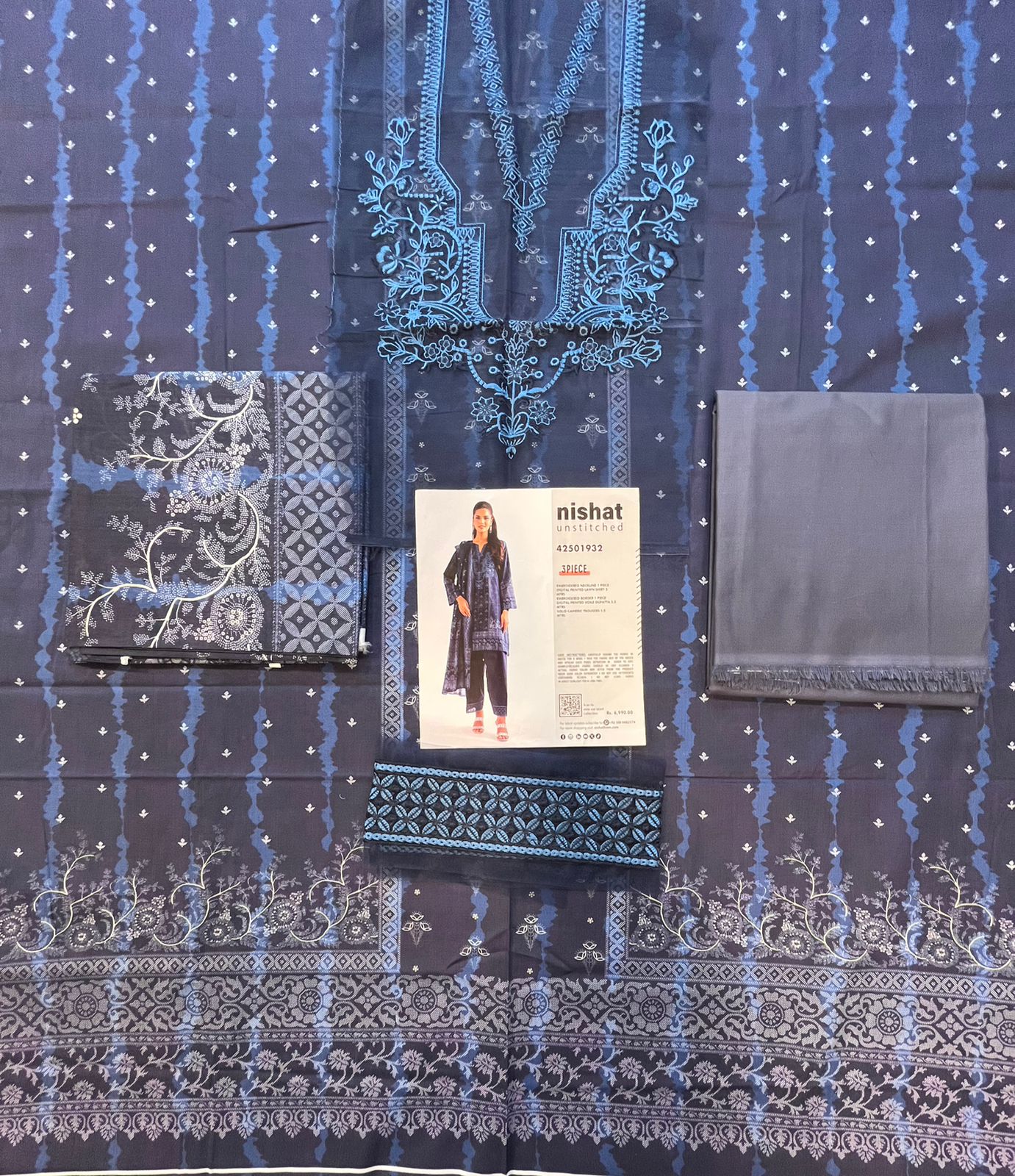 Full layout display of the shirt, dupatta, and trousers of the Nisha By Nishat Embroidered Lawn 3pc.