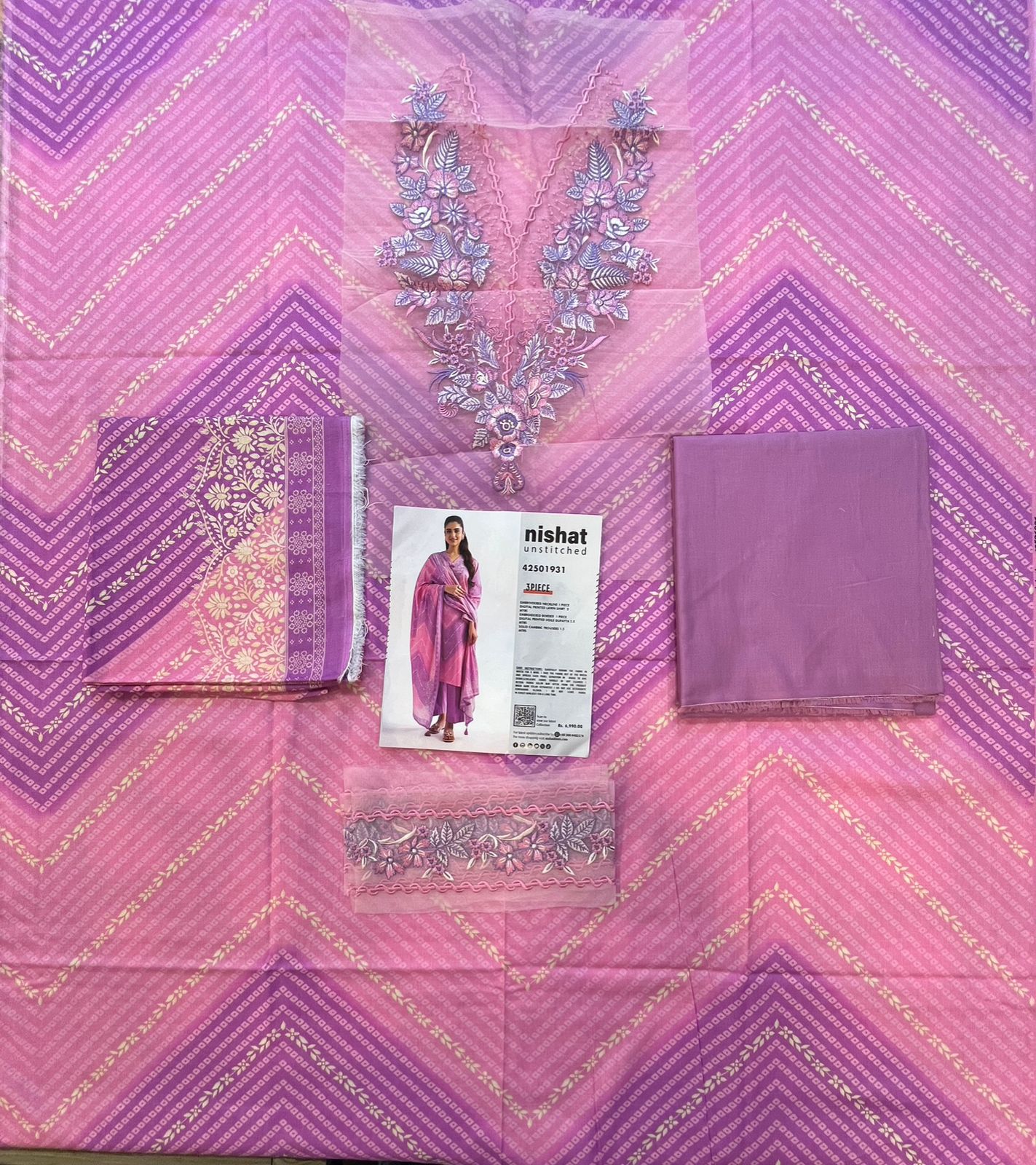 Full layout display of the shirt, dupatta, and trousers of the Nisha By Nishat Embroidered Lawn 3pc.