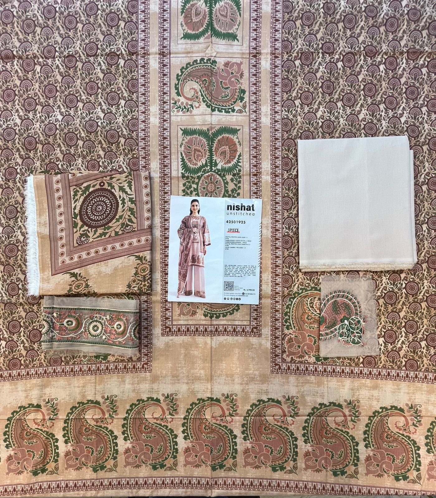 Full layout display of the shirt, dupatta, and trousers of the Nisha By Nishat Embroidered Lawn 3pc.