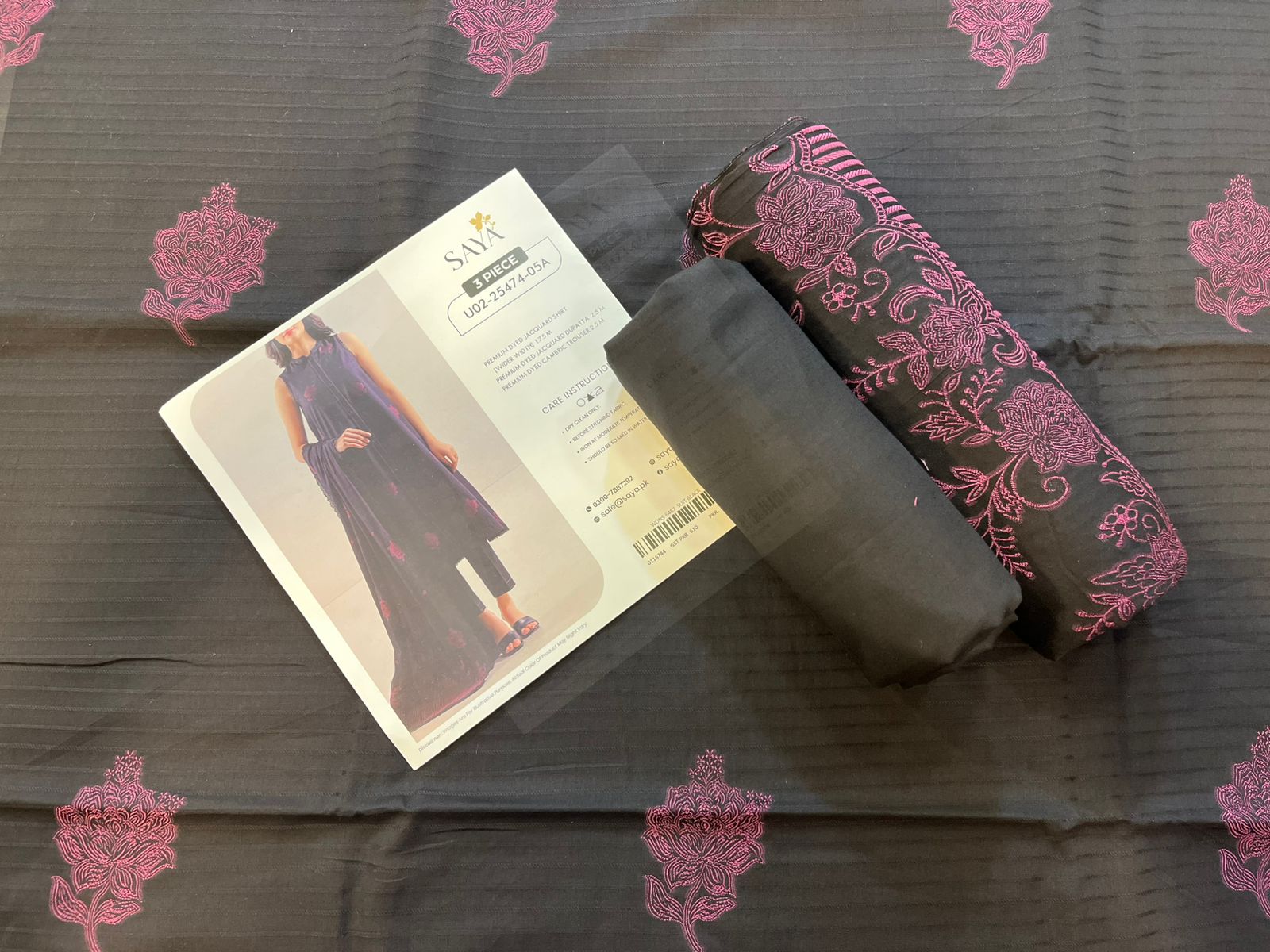 Close-up texture of Black Saya Cotton Jacquard 3pc self-woven fabric.