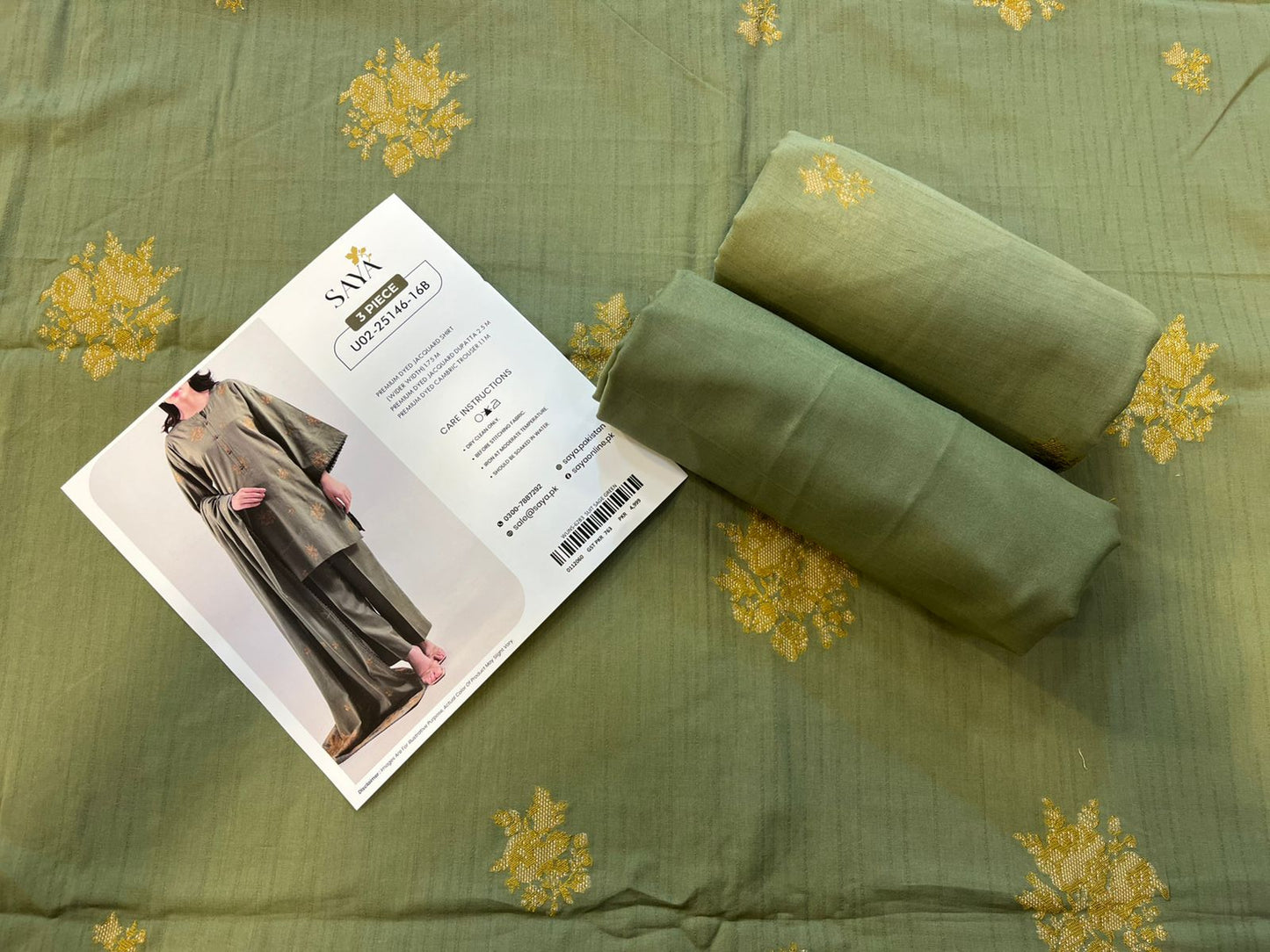 Close-up texture of Sage Green Saya Cotton Jacquard 3pc self-woven fabric.