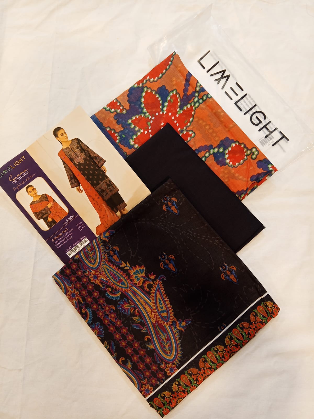 Close-up of the vibrant patterns on Phantom Shade LimeLight Lawn 3pc Suit unstitched fabric.