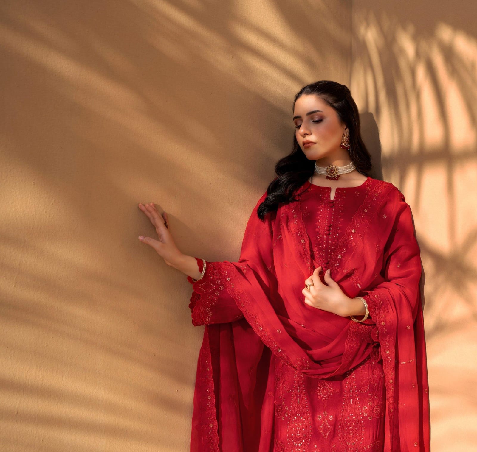 Red Iconic Rujhan Luxury Cotton 3pc suit worn by model showcasing a classic luxury festive ensemble.