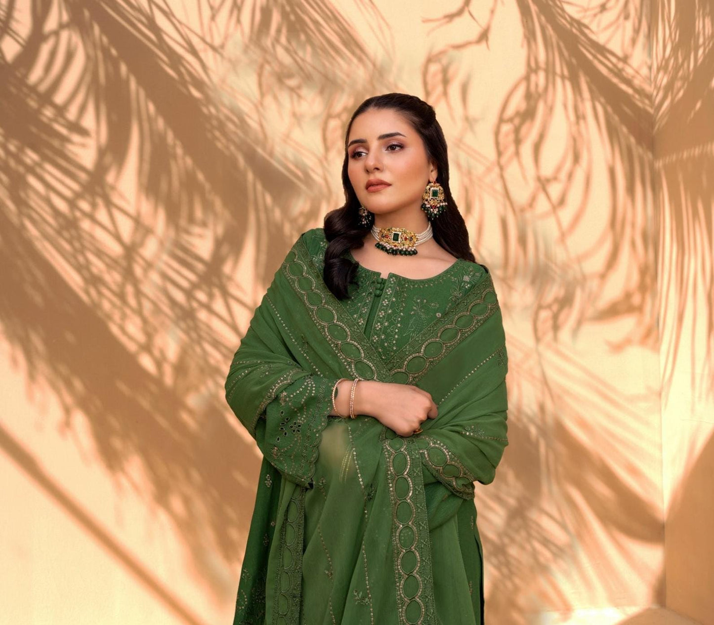 Green Iconic Rujhan Luxury Cotton 3pc suit worn by model highlighting the luxury chiffon dupatta.