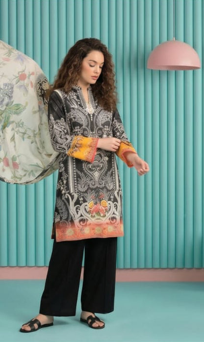 Model wearing a Salina Mid Summer Cotton Suit 3pc Unstitched in black with colorful floral dupatta.