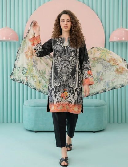 Model wearing a black Salina Mid Summer Cotton Suit 3pc unstitched with floral dupatta against a colorful backdrop.