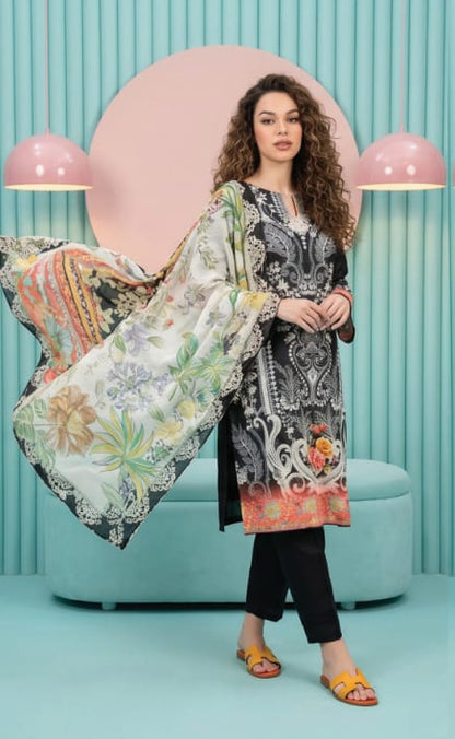 Model showcasing the Salina Mid Summer Cotton Suit 3pc Unstitched in black with floral dupatta in a stylish studio setting.