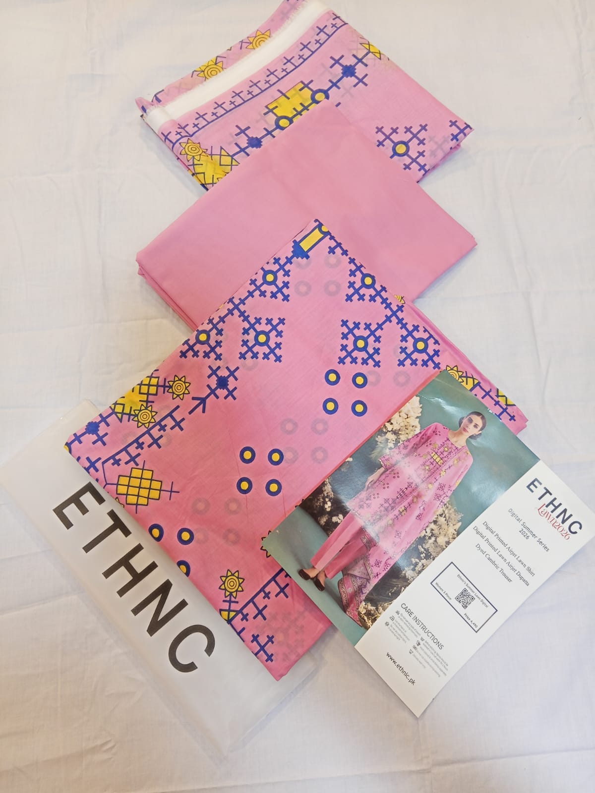 ETHNC Lawn 3pc Unstitched – Bubblegum Pink fabric set including shirt, dupatta, and trouser.