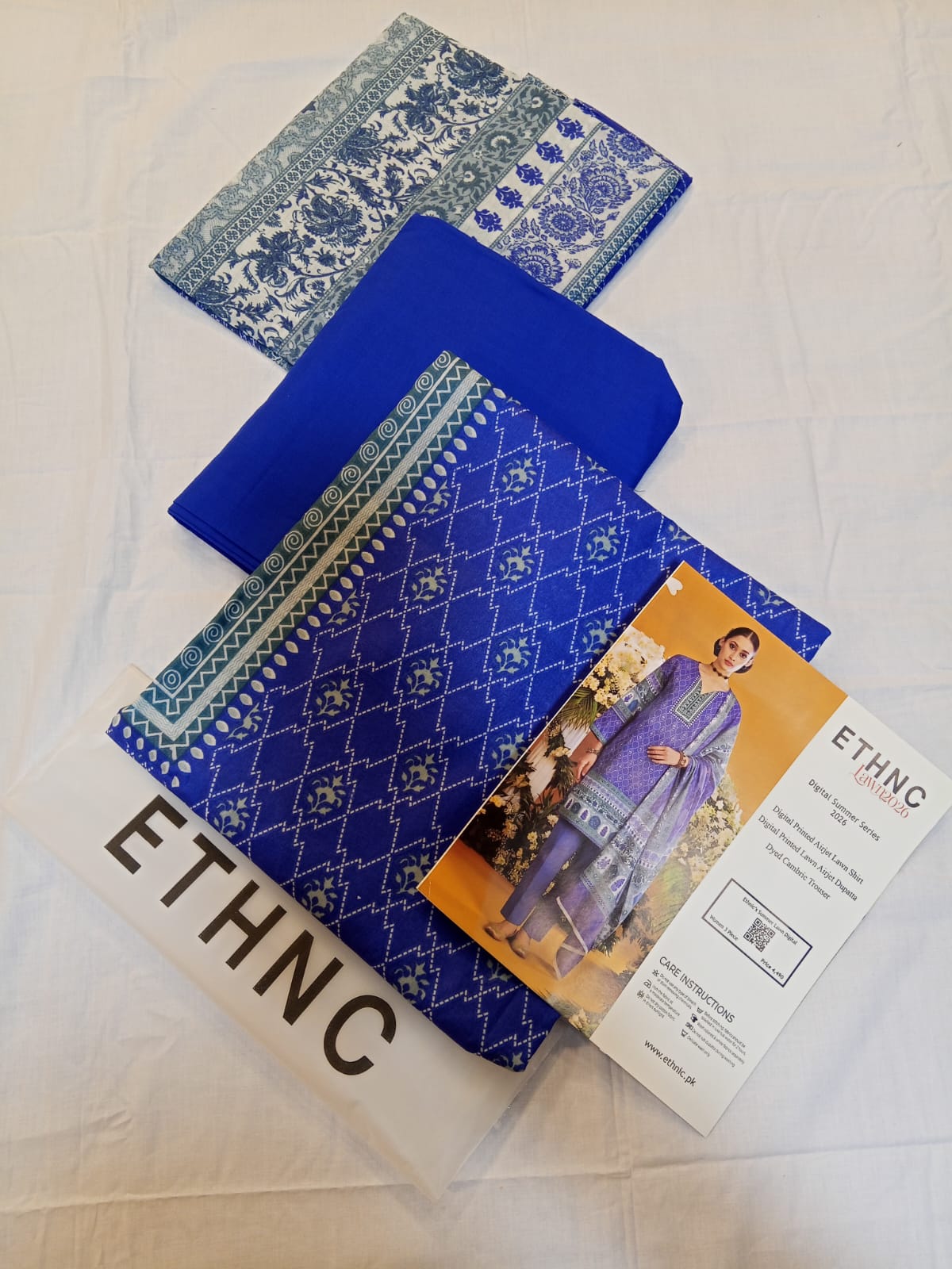 ETHNC Lawn 3pc Unstitched featuring a digital printed shirt, dupatta, and dyed trouser in royal cobalt.