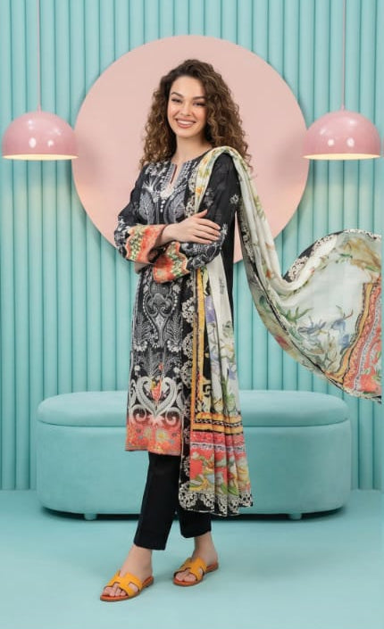 Model showcasing the Salina Mid Summer Cotton Suit 3pc Unstitched in black with vibrant dupatta and stylish sandals.