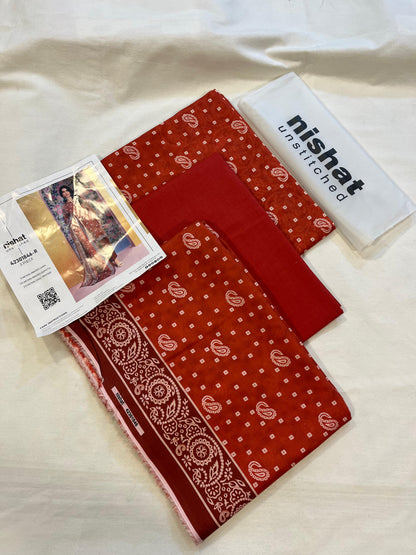 Nisha By Nishat 3pc Unstitched Lawn - Red, includes fabric pieces and a printed shirt catalog.