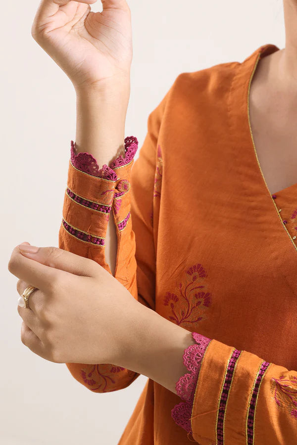 Rust Saya Cotton Jacquard 3pc suit worn by model showcasing luxury unstitched tailoring.