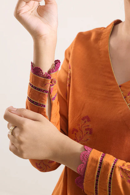 Rust Saya Cotton Jacquard 3pc suit worn by model showcasing luxury unstitched tailoring.